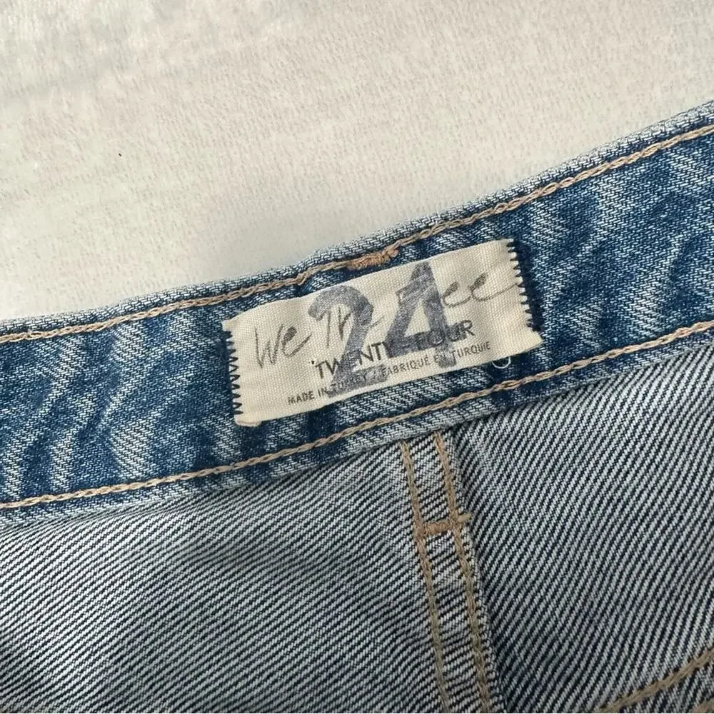 Free People good time beach bum distressed Jean shorts blue denim button fly 24